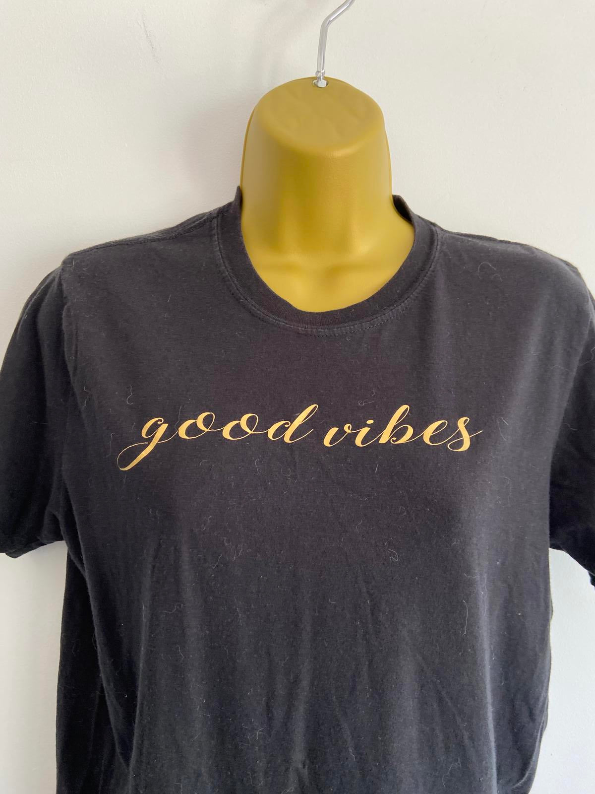 Medium Black T-shirt with the writing in gold 'Good Vibes'